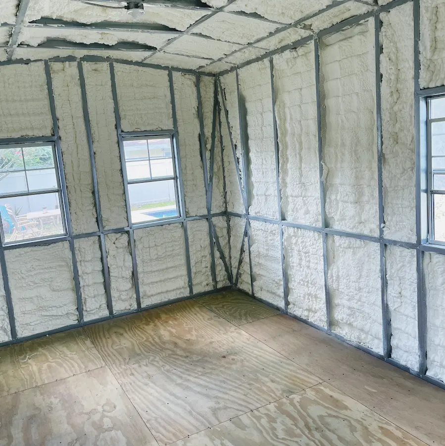 Closed-cell spray foam insulation applied to wall cavities in a residential project in Oldsmar